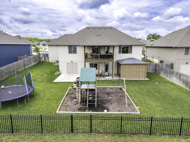 994 S Cumberland Ave, Republic, MO 65738 - back of property with a patio, a trampoline, a balcony, roof with shingles, and an outdoor structure