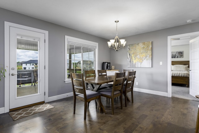 994 S Cumberland Ave, Republic, MO 65738 - dining space featuring a chandelier, dark wood-type flooring, and baseboards