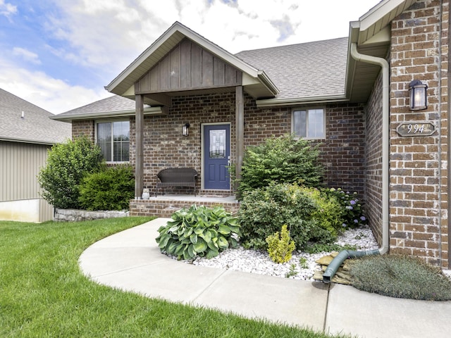994 S Cumberland Ave, Republic, MO 65738 - view of exterior entry with brick siding, roof with shingles, and board and batten siding