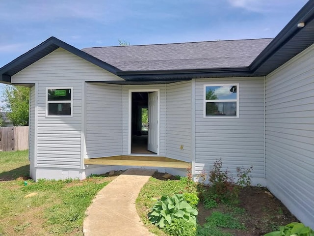 712 Fir St, Buffalo, MO 65622 - view of exterior entry featuring roof with shingles