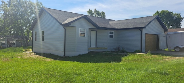 712 Fir St, Buffalo, MO 65622 - view of front of property featuring a garage, asphalt driveway, a front lawn, and roof with shingles