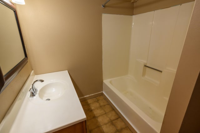 1288 County Road 334, Tecumseh, MO 65760 - bathroom with vanity, bathing tub / shower combination, tile patterned flooring, and baseboards