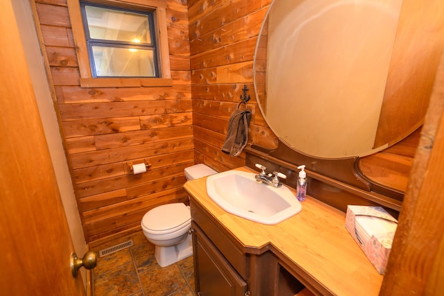 1288 County Road 334, Tecumseh, MO 65760 - bathroom with wooden walls, vanity, and toilet
