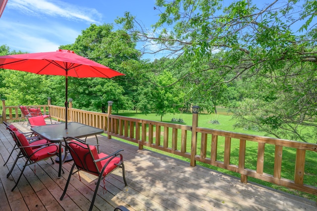 1288 County Road 334, Tecumseh, MO 65760 - wooden deck featuring outdoor dining area, a yard, and view of scattered trees