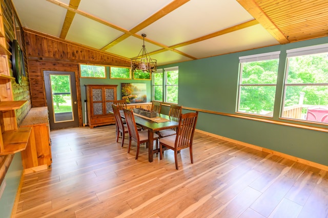 1288 County Road 334, Tecumseh, MO 65760 - dining room with healthy amount of natural light, a chandelier, baseboards, light wood finished floors, and wood walls