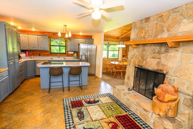 1288 County Road 334, Tecumseh, MO 65760 - kitchen featuring stainless steel fridge with ice dispenser, gray cabinets, a sink, light countertops, and a ceiling fan