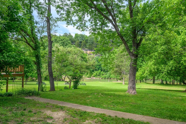 1288 County Road 334, Tecumseh, MO 65760 - surrounding community featuring a lawn and a deck
