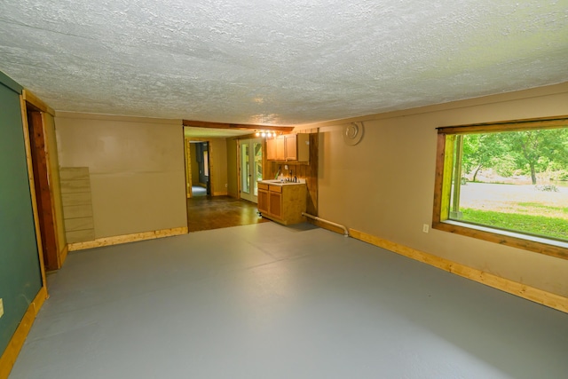 1288 County Road 334, Tecumseh, MO 65760 - basement with baseboards and a textured ceiling