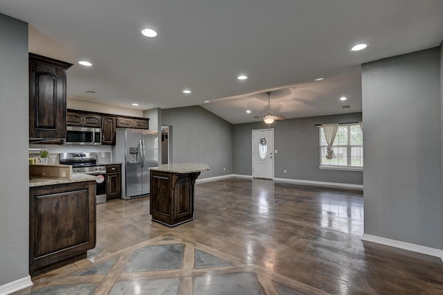 3383 Lusk Dr, Neosho, MO 64850 - kitchen with stainless steel appliances, dark brown cabinets, a kitchen island, baseboards, and recessed lighting