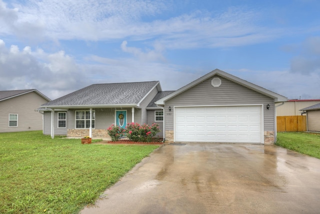 3383 Lusk Dr, Neosho, MO 64850 - ranch-style house with driveway, a front lawn, an attached garage, and stone siding