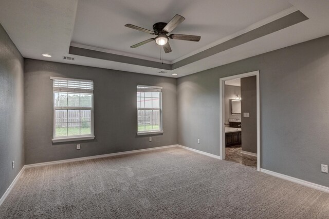 3383 Lusk Dr, Neosho, MO 64850 - empty room with a raised ceiling, ceiling fan, carpet, baseboards, and crown molding
