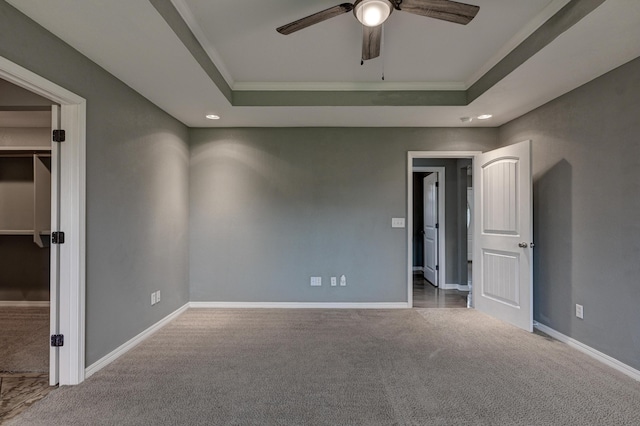 3383 Lusk Dr, Neosho, MO 64850 - unfurnished bedroom with carpet, a tray ceiling, baseboards, ornamental molding, and recessed lighting
