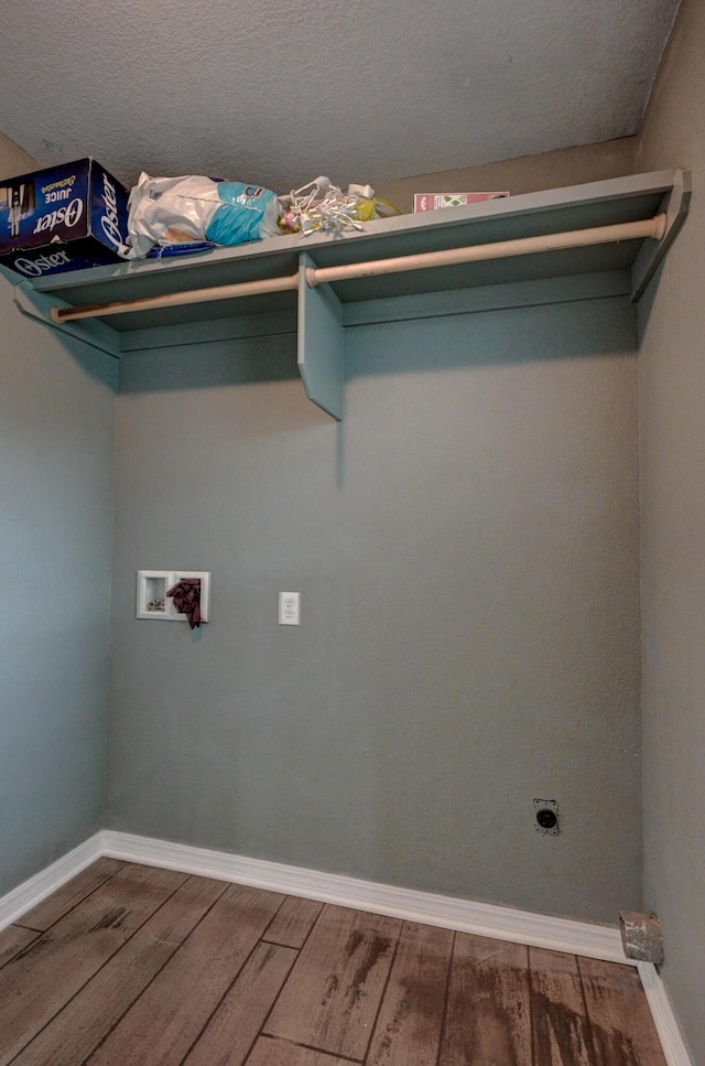 3383 Lusk Dr, Neosho, MO 64850 - laundry area with electric dryer hookup, hookup for a washing machine, wood finished floors, and baseboards