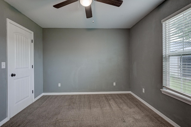 3383 Lusk Dr, Neosho, MO 64850 - spare room with ceiling fan, carpet flooring, and baseboards