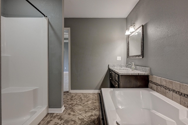 3383 Lusk Dr, Neosho, MO 64850 - bathroom with vanity, a garden tub, a shower, marble look tile flooring, and a textured wall
