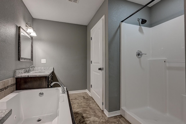 3383 Lusk Dr, Neosho, MO 64850 - full bathroom featuring a shower stall, vanity, a bath, baseboards, and a textured wall