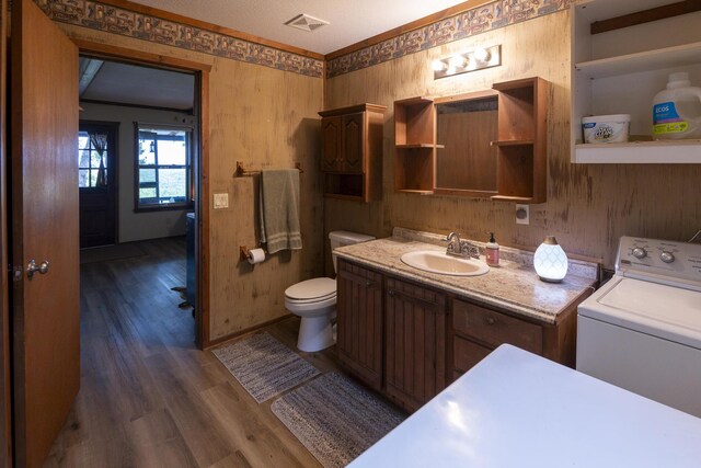 651/TBD Round Robin Ln, Yellville, AR 72687 - bathroom featuring washer / dryer, wood finished floors, toilet, and vanity