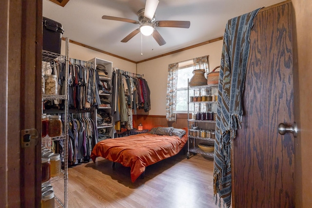 651/TBD Round Robin Ln, Yellville, AR 72687 - bedroom featuring wood finished floors, wainscoting, ornamental molding, and ceiling fan