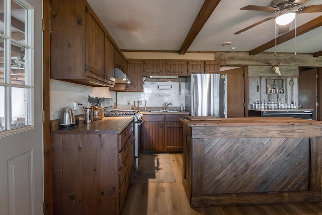 651/TBD Round Robin Ln, Yellville, AR 72687 - kitchen featuring stainless steel appliances, light wood-type flooring, under cabinet range hood, beamed ceiling, and butcher block countertops