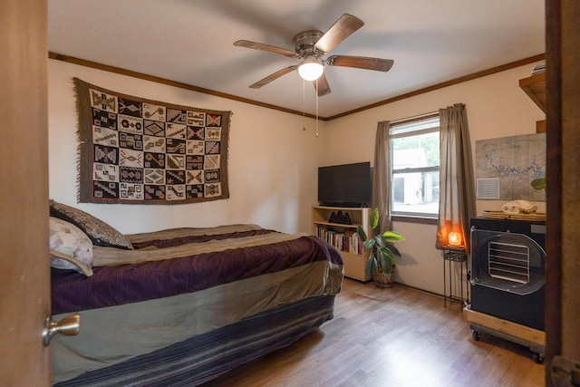 651/TBD Round Robin Ln, Yellville, AR 72687 - bedroom with wood finished floors, ornamental molding, ceiling fan, and radiator
