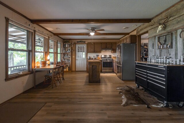 651/TBD Round Robin Ln, Yellville, AR 72687 - kitchen with appliances with stainless steel finishes, under cabinet range hood, light countertops, wood finished floors, and ceiling fan