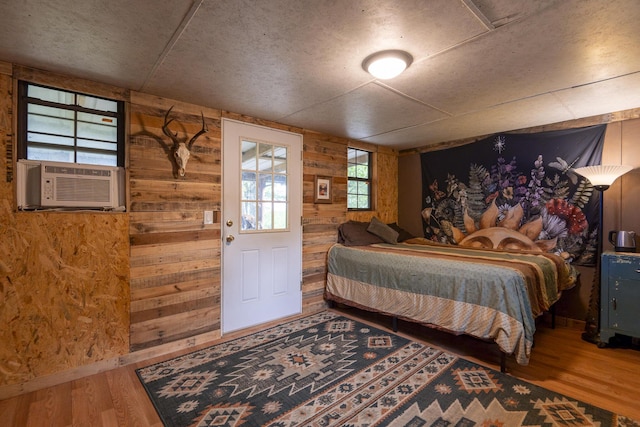 651/TBD Round Robin Ln, Yellville, AR 72687 - bedroom featuring wood finished floors, wooden walls, and cooling unit