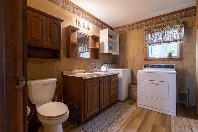 651/TBD Round Robin Ln, Yellville, AR 72687 - bathroom with independent washer and dryer, toilet, vanity, and wood finished floors