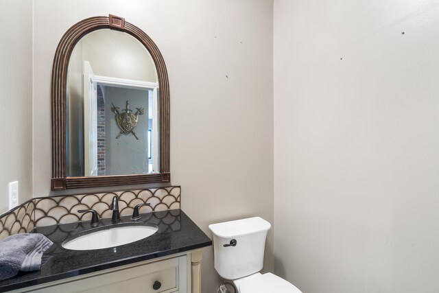 807 S Stanford Dr, Rogersville, MO 65742 - half bath with vanity, toilet, and tasteful backsplash