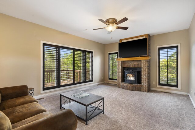 807 S Stanford Dr, Rogersville, MO 65742 - living room featuring plenty of natural light, baseboards, ceiling fan, and carpet flooring