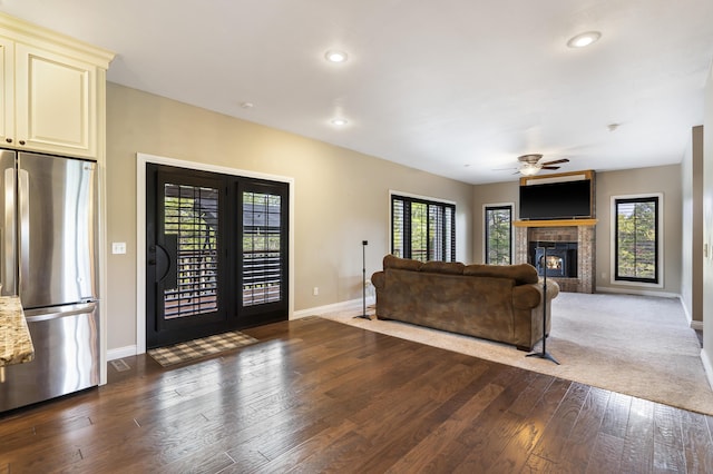 807 S Stanford Dr, Rogersville, MO 65742 - living area with baseboards, ceiling fan, plenty of natural light, a tiled fireplace, and recessed lighting