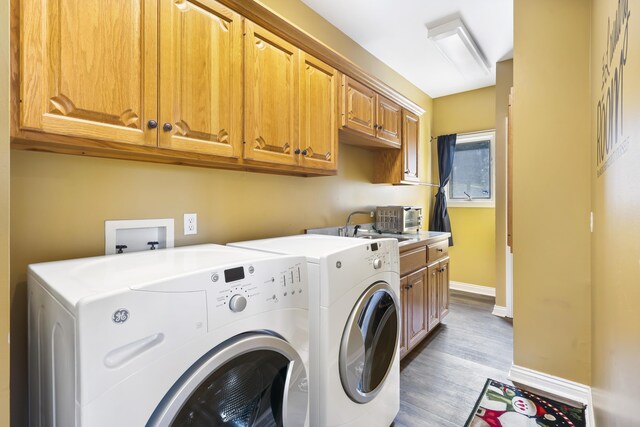 807 S Stanford Dr, Rogersville, MO 65742 - laundry area with separate washer and dryer, cabinet space, light wood-type flooring, and baseboards