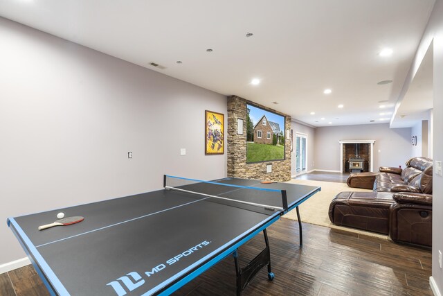 807 S Stanford Dr, Rogersville, MO 65742 - recreation room featuring dark wood-style flooring, a glass covered fireplace, baseboards, and recessed lighting