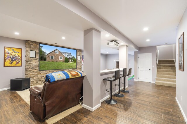 807 S Stanford Dr, Rogersville, MO 65742 - living room featuring baseboards, wood finished floors, stairs, recessed lighting, and bar area