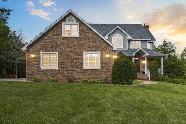 807 S Stanford Dr, Rogersville, MO 65742 - view of front of property with brick siding, a chimney, a front lawn, and a shingled roof