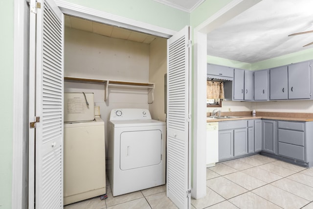 2116 N Campbell Ave, Springfield, MO 65803 - washroom featuring independent washer and dryer, light tile patterned flooring, and ceiling fan