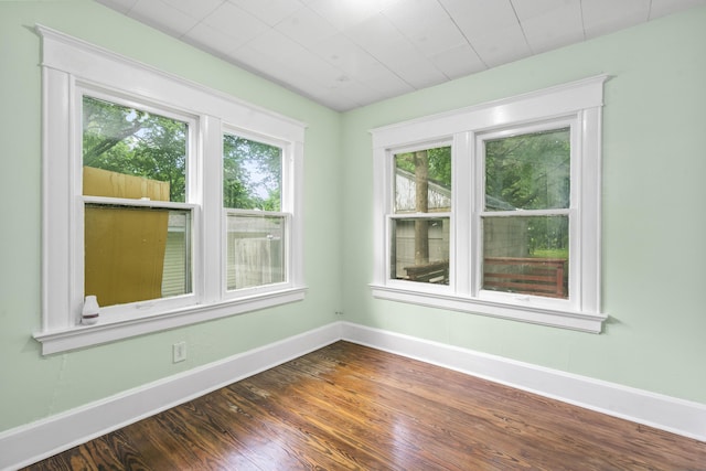 2116 N Campbell Ave, Springfield, MO 65803 - empty room with baseboards and wood finished floors