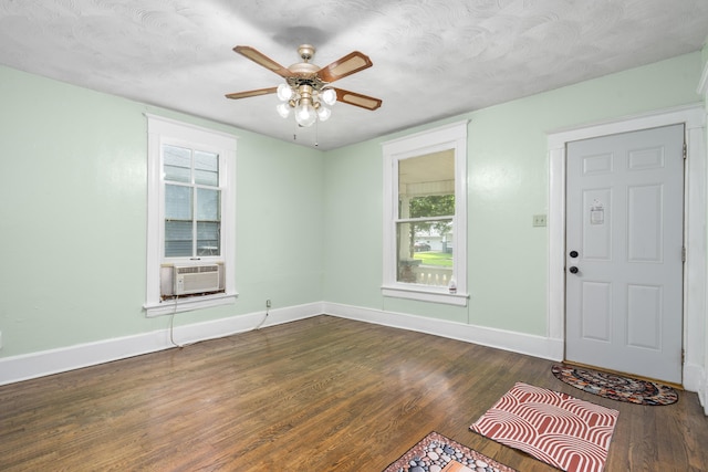 2116 N Campbell Ave, Springfield, MO 65803 - entrance foyer featuring baseboards, dark wood-type flooring, ceiling fan, and cooling unit