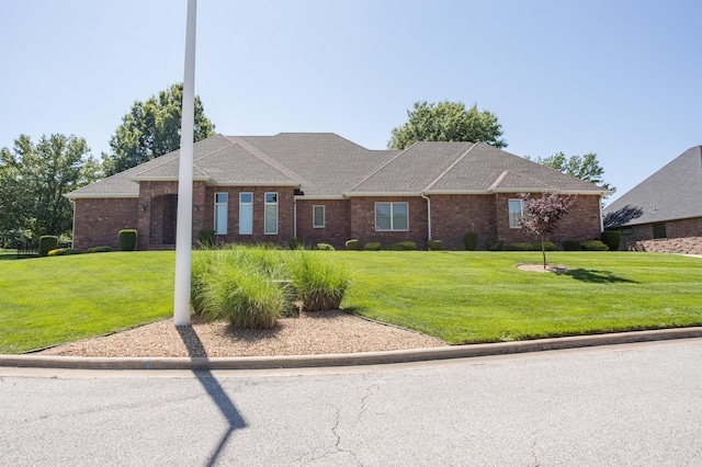8326 Shinnecock Dr, Nixa, MO 65714 - view of front facade featuring a front yard and brick siding