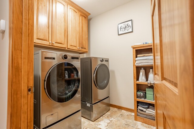 8326 Shinnecock Dr, Nixa, MO 65714 - washroom featuring washer and clothes dryer, cabinet space, and baseboards