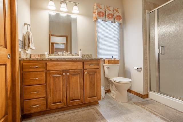8326 Shinnecock Dr, Nixa, MO 65714 - bathroom with toilet, vanity, a shower stall, and tile patterned floors