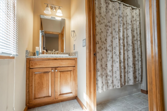 8326 Shinnecock Dr, Nixa, MO 65714 - full bathroom featuring vanity, tile patterned floors, and baseboards