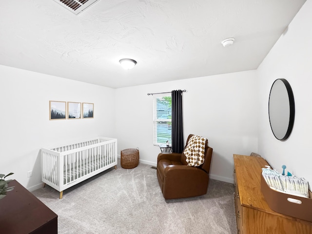 3824 N Spring Branch Ave, Springfield, MO 65803 - carpeted bedroom featuring baseboards and a crib