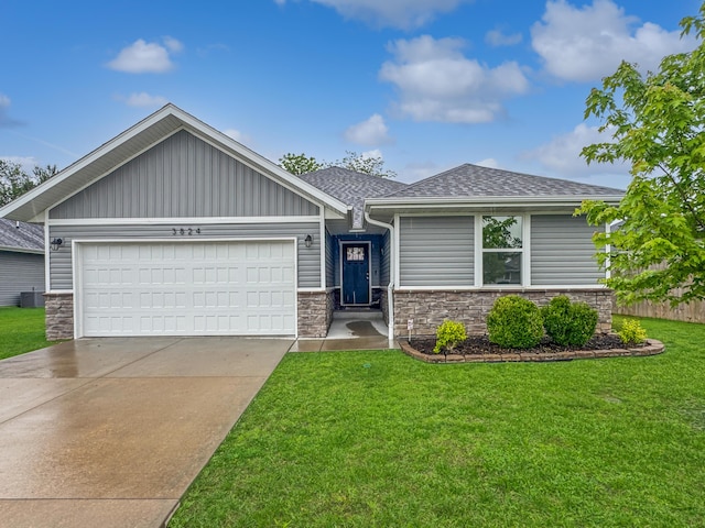 3824 N Spring Branch Ave, Springfield, MO 65803 - view of front of house with an attached garage, roof with shingles, a front lawn, concrete driveway, and stone siding