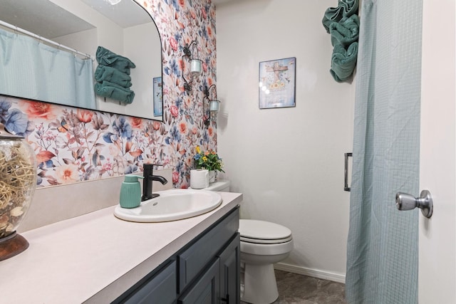 1127 E Livingston Ct, Springfield, MO 65803 - bathroom with toilet, vanity, and baseboards