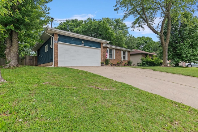1127 E Livingston Ct, Springfield, MO 65803 - view of front of property with a garage, concrete driveway, and brick siding
