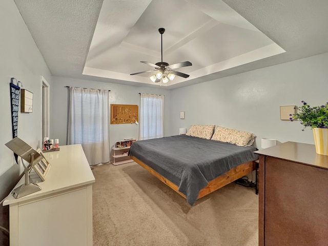 5726 S Fairview Ave, Springfield, MO 65810 - bedroom featuring a tray ceiling, light colored carpet, and ceiling fan