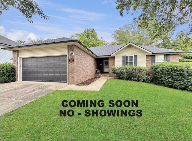 5726 S Fairview Ave, Springfield, MO 65810 - ranch-style house featuring brick siding, an attached garage, driveway, a front lawn, and roof with shingles
