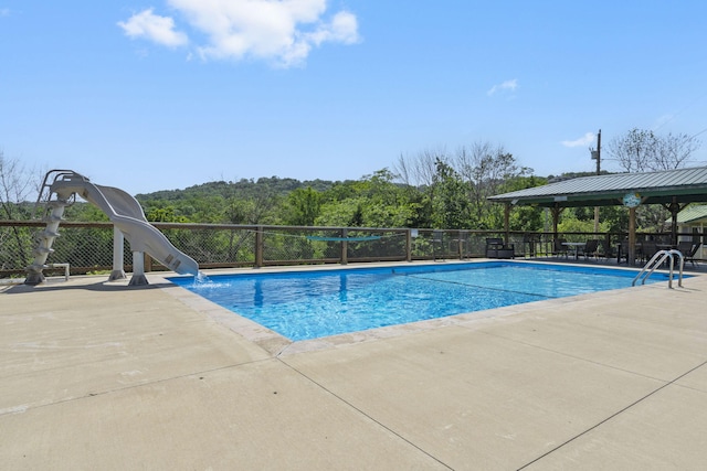 638 Double Day, Branson West, MO 65737 - view of swimming pool with a water slide, a patio area, and a gazebo