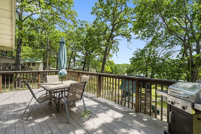 638 Double Day, Branson West, MO 65737 - wooden deck with outdoor dining space and a grill