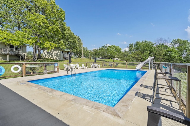 638 Double Day, Branson West, MO 65737 - community pool featuring a water slide and a patio
